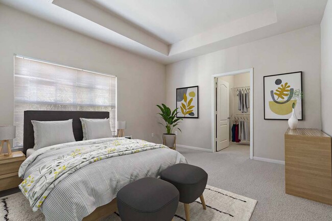 Bedroom with plush carpeting and spacious closet