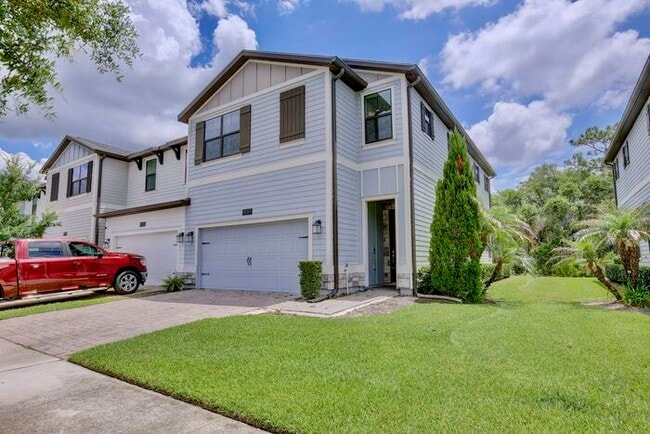 Photo - Beautiful 4/3.5 Townhome with a Spacious 2 Car Garage Located in Trails at Moss Park - Orlando