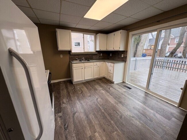 Photo - Classic Akron Home, Modern Convenience: Deck, First Floor Bedroom & Laundry and 2 Sunroom's