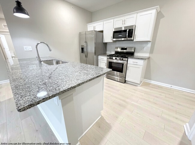 Open Concept Kitchen w. Breakfast Bar - Howard Meadow Apartment Homes