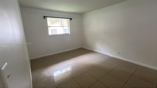 Building Photo - 8704 NW 35th St Unit 208