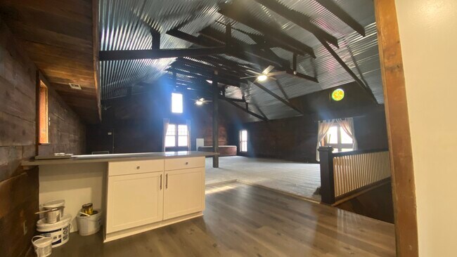 Soaring tin ceilings with beams - 5 S Batavia Ave Unidad Coach House