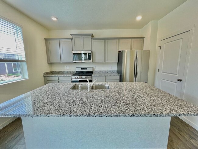 Photo - Spacious 4-Bedroom Wellington Home with 3-Car Garage, Loft & Fenced Backyard!