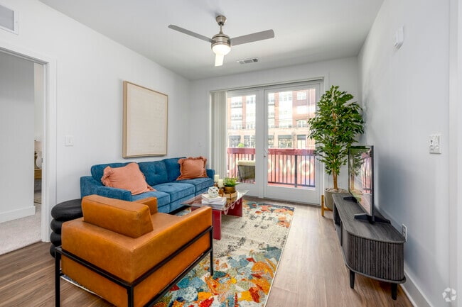 2BR, 2BA – 871SF - Living Room - Flats at College Park
