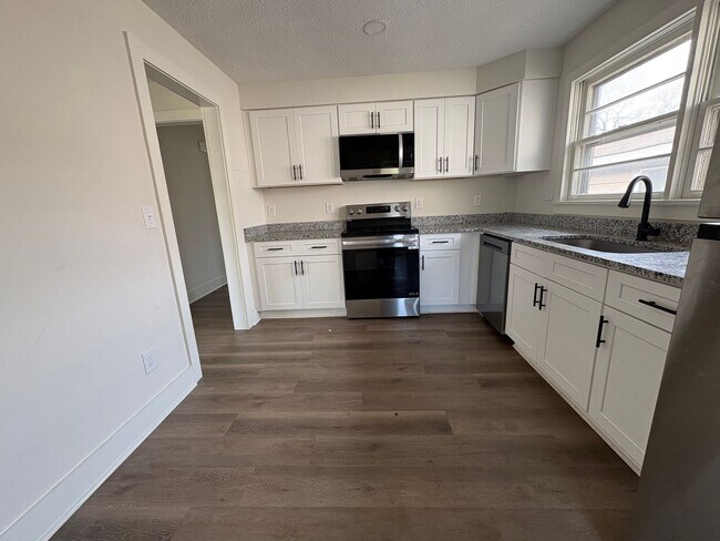 Photo - Fully Renovated 3BR/1.5BA – Prime Location + Lawn Care Included