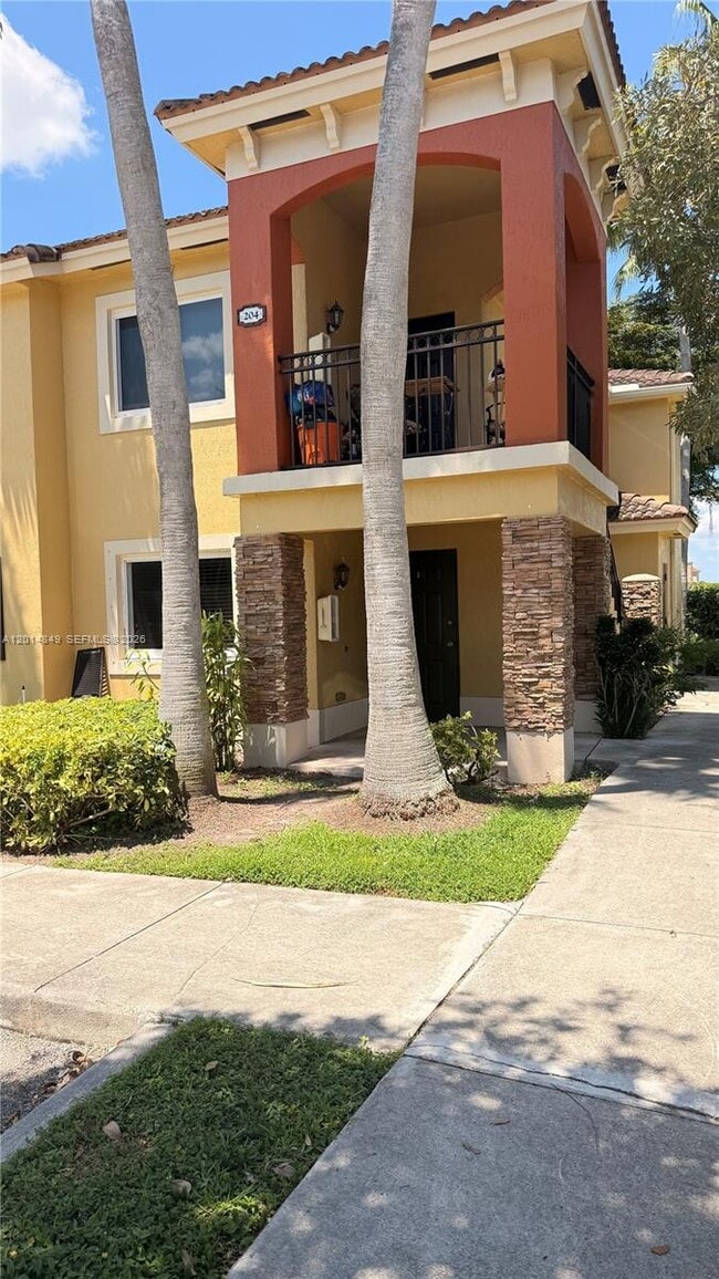 Building Photo - 990 NE 33rd Terrace Unit 104