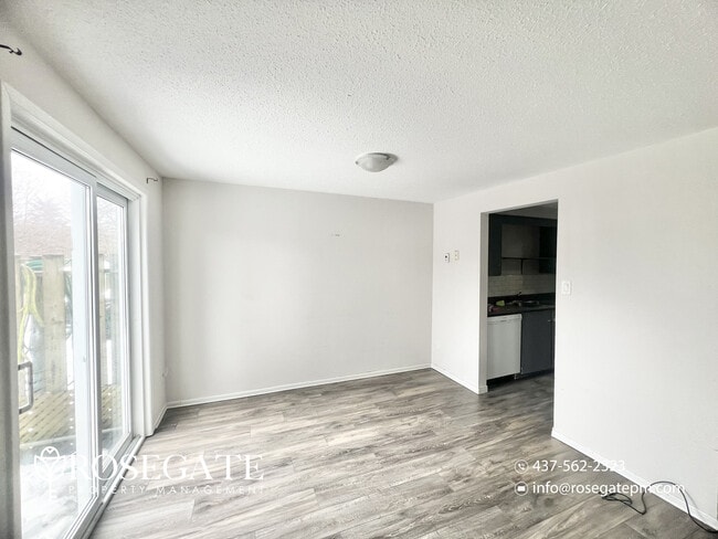 Photo - Spacious 3-Bedroom Stacked Townhouse with Garage & Backyard in Waterloo Unit 2