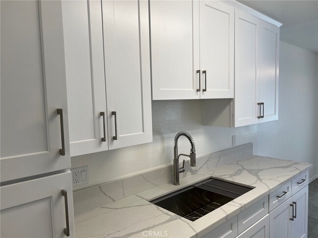 Building Photo - 7039 Remmet Ave Unit I-I Rental