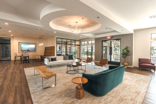 Clubroom sitting area with couches - Monterey Ranch Apartments