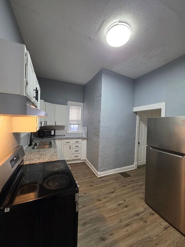 Photo - Comfortable 3-Bedroom Home with Private Upstairs Suite