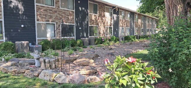 Flowers are blooming here at our property along the river rock bed