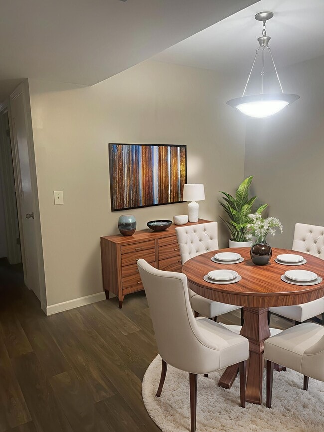 Explore the inviting ambiance of Riverwood Park Apartments, where modern design meets comfort. The stylish dining area is perfect for gatherings, complemented by chic decor. Ready to elevate your living experience? Inquire today!
