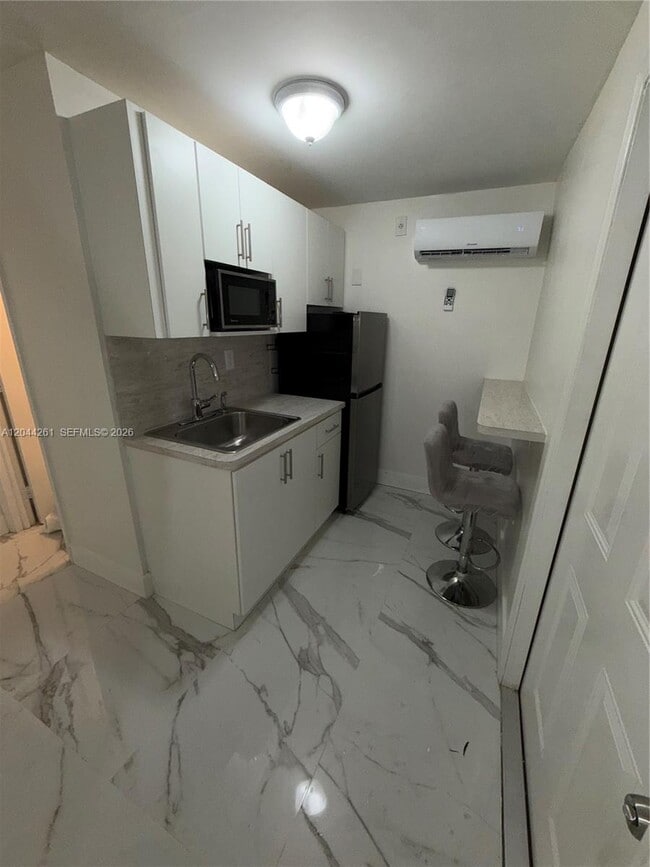 Building Photo - 6497 W 8th Ln Unit 6497
