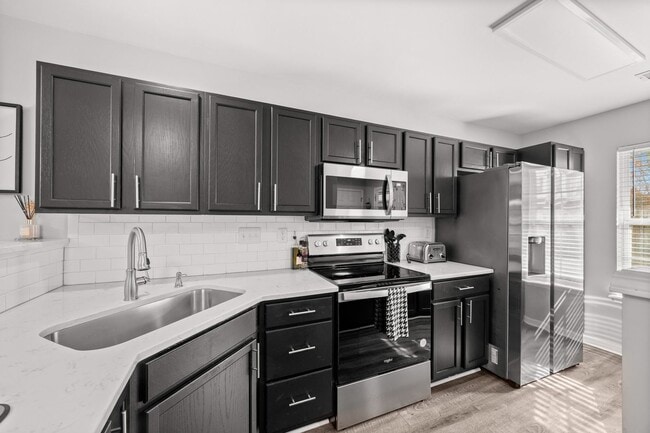 Photo - This immaculate 3-bed, 2.5 bath townhome in the Olde Stone Crossing community with the primary be...