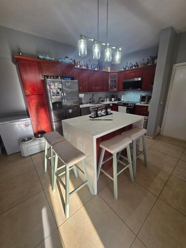 Building Photo - 9727 Hammocks Blvd Unit 207D