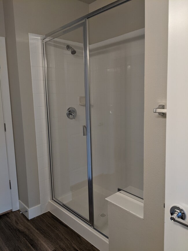 Spacious shower with built-in bench - 14341 E Tennessee Ave Unit 204