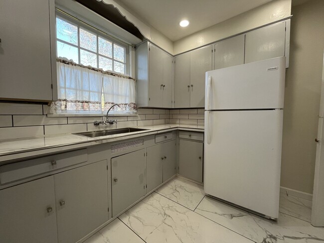 Photo - Spacious Multi-Level Living with Vaulted Ceilings and Backyard Access