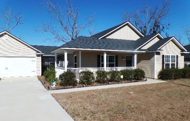 Building Photo - Charming 3BR Home with Open Floor Plan, Screened Porch & Covered Front Porch in Lakeland