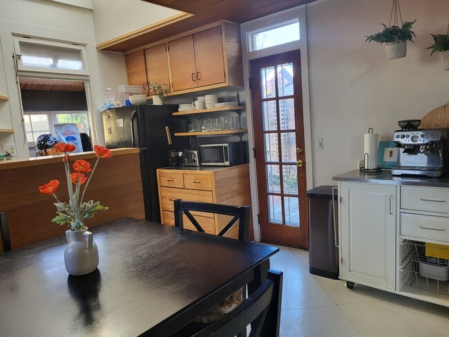 Dining Area looking to Deck with Greenhouse Door to the left - 336 S Washington St