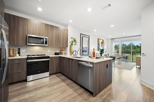 Chef-inspired kitchen with premium appliances, a spacious island and premium granite countertops with open-concept floor plan