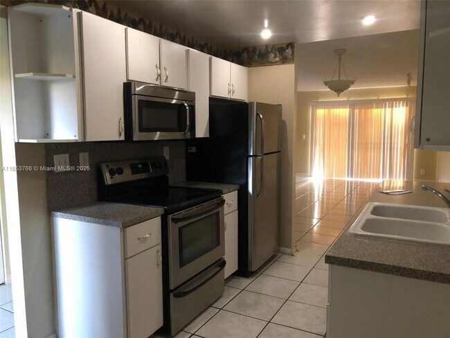 Building Photo - 8450 Lagos De Campo Blvd Unit 105 Rental