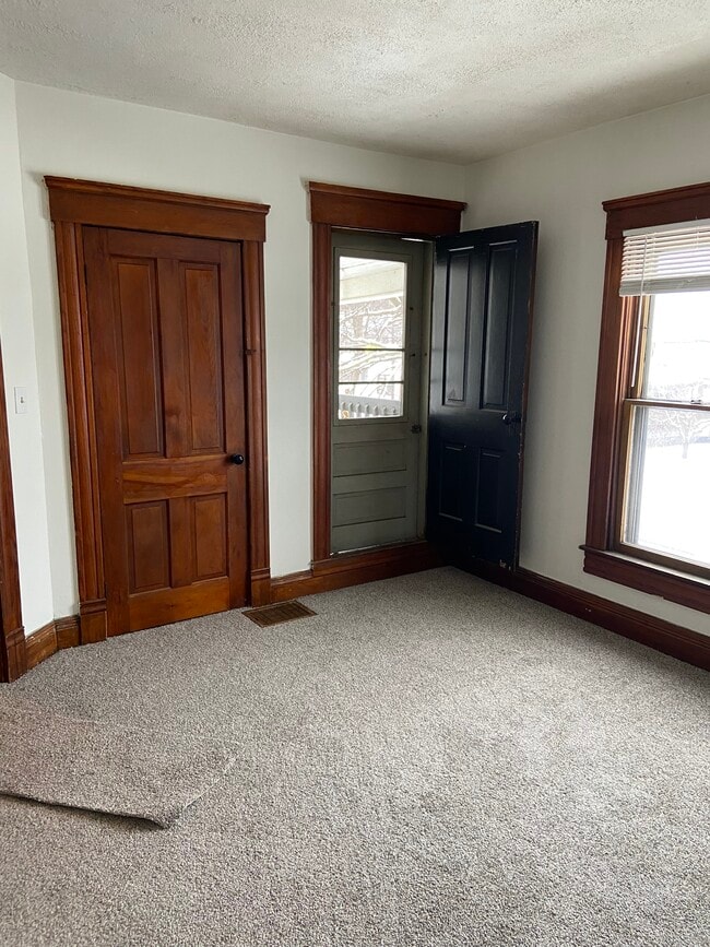 Living area with balcony and large walk in closet