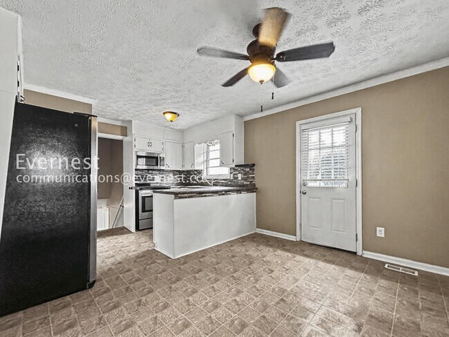 Photo - 3 Bed, 2 Bath Home with Carport / Pet-Friendly / Coming Soon!