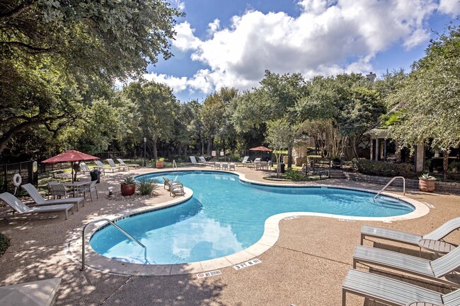 Relax by the resort-style pool and spa with spacious sundeck and lounge seating. - Alister Sunset Valley Apartments