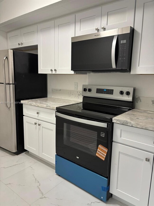 Building Photo - 18840 NW 57th Ave Unit 301