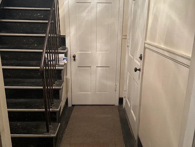 Inside entryway, stairs to upstairs flat and door to divided basement and laundry area - 1368 Doten Ave Unit 1368 Doten Avenue Flat #A