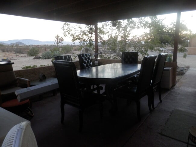 Enclosed Patio has table & chairs. - 1050 Alta Ave