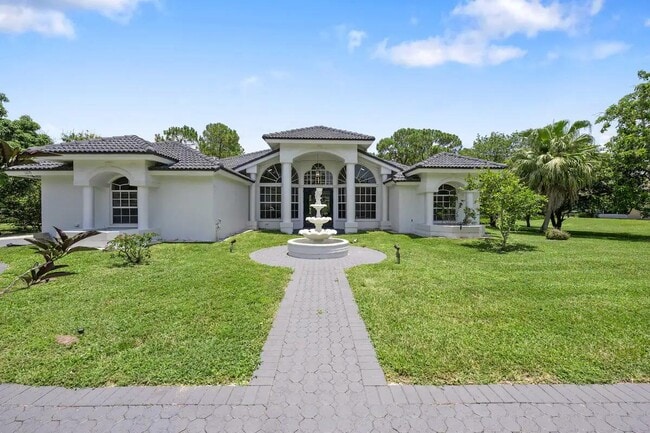Building Photo - 6670 Royal Palm Beach Blvd Rental