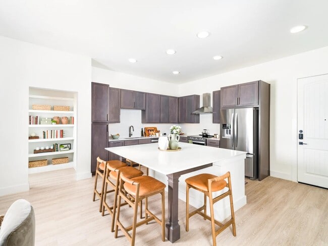 Gather with ease in Modera Trailhead’s gourmet kitchens, featuring expansive islands, sleek cabinetry, and stainless-steel appliances.