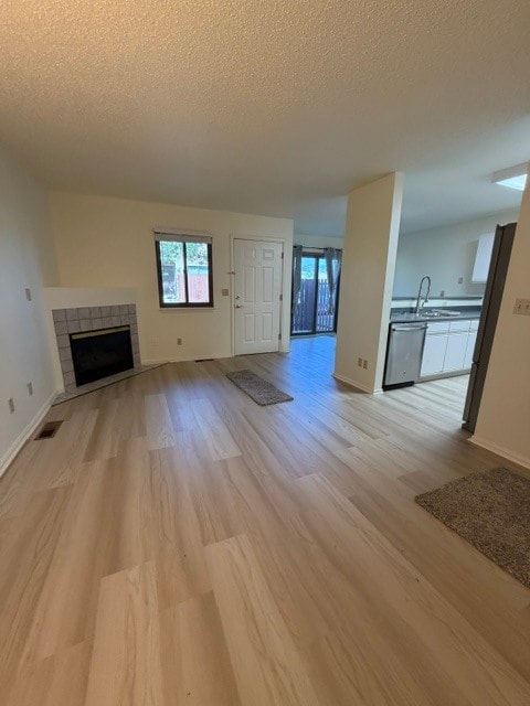 Family Room with New Flooring and Gas Fireplace Throughout - 18294 W 58th Pl Unit 14