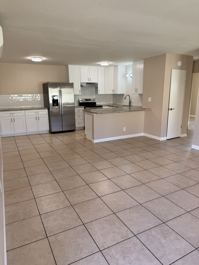 Living room with open kitchen - 1749 S Maple St Apartments Unit Duplex