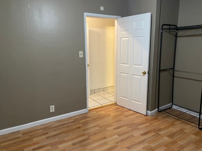 Laminate Hardwood transitions to Ceramic Tile hallway - 2220 Gale Ave