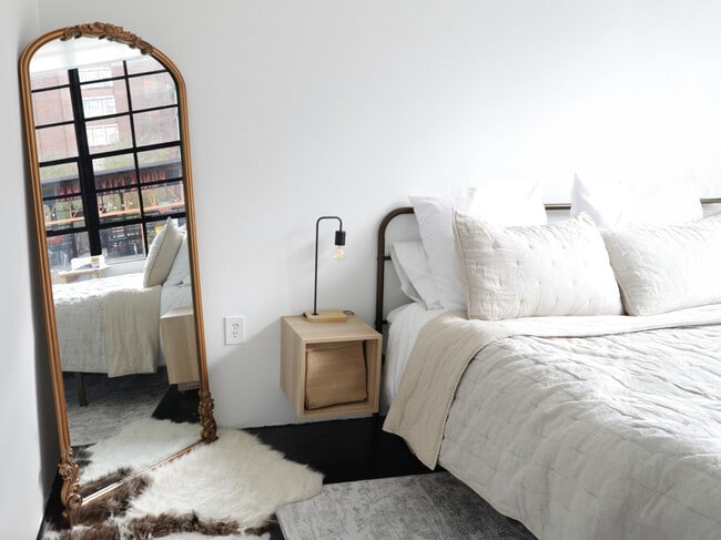 Factory Windows Bedroom Beltline View and Gold Vintage Mirror