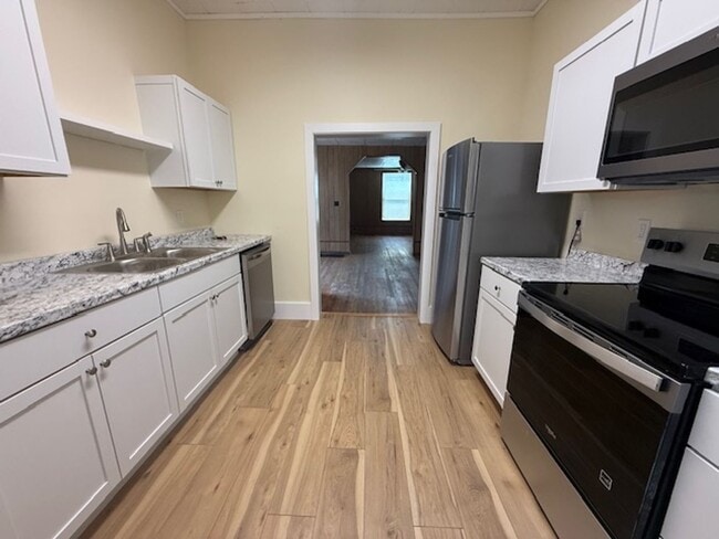 Photo - Classic Hardwood Floors, Fenced Yard & 2-Car Garage