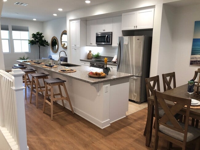 Building Photo - Gorgeous 4 bed/4 bath w/2 car garage in new community w/pool less than 1 mile to the beach!