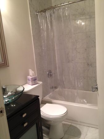 Bathroom with Marble tile.- there is a new vanity pic coming soon - 600 Broadway Ave NW Unit 132