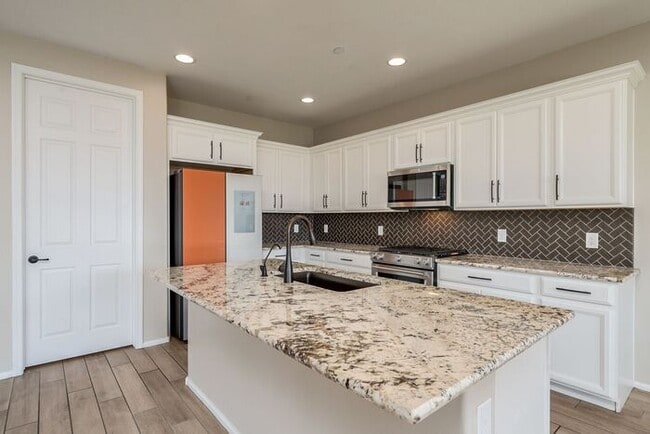 Photo - Amazing 4BR 2.5BA Home w/ 3-Car Tandem Garage • Pool Access • Yard w/ Fire Pit in Saguaro Trails