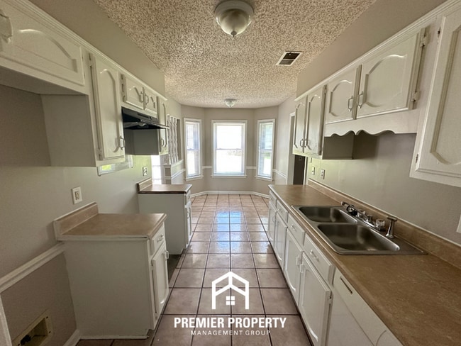 Photo - Beautiful 4BR/2BA Near Southwind | 1,853 Sq Ft, Dual Dining Areas, Fireplace & Garage