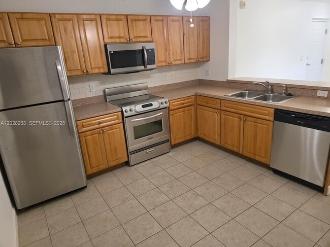 Building Photo - 10115 W Sunrise Blvd Unit 104
