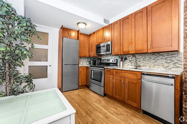 Building Photo - 129 W 56th St Unit 5F Rental
