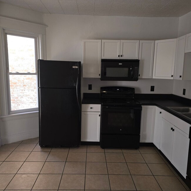 Photo - Large remodeled 4 bedroom with off street parking available**FREE MONTH OF RENT TO ANYONE WHO SIG... Unit 507- 509 Nott St - 1