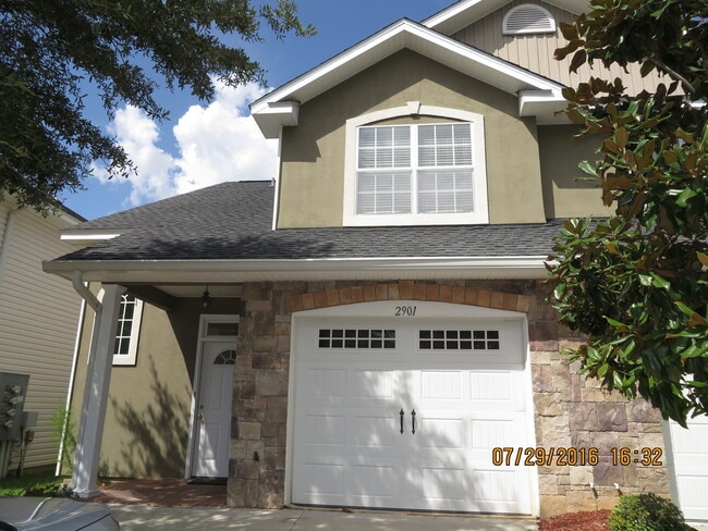 Photo - 3 bedroom town home for rent early January 2026, gated community with a garage for $1850 per month