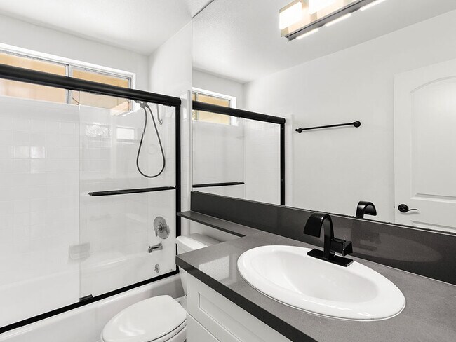 Modern styled bathroom with shower and tub.