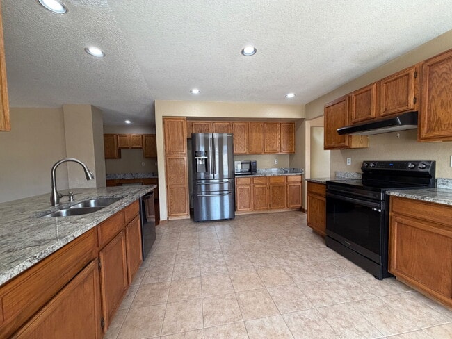 Photo - ~Available Now~ Beautiful Four Bedroom Home with Fireplace, Private Yard & Luxurious Primary Suite!