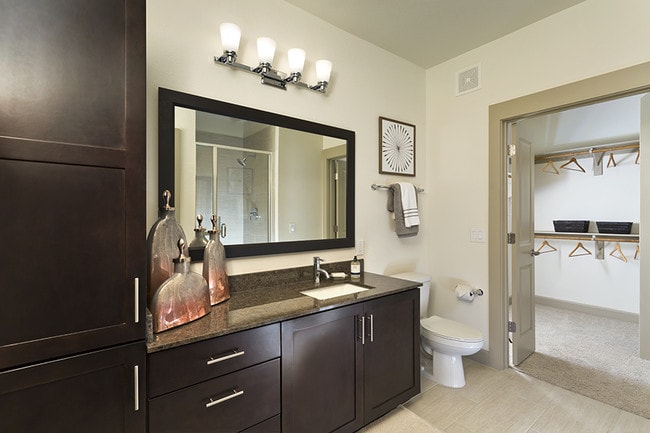 Walk-in showers with glass doors and ceramic tile surround