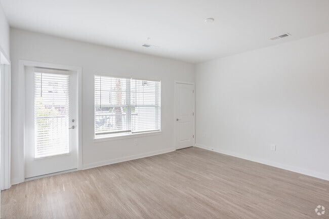 1BR, 1BA - 774SF - Living Room - Emblem Cane Bay North
